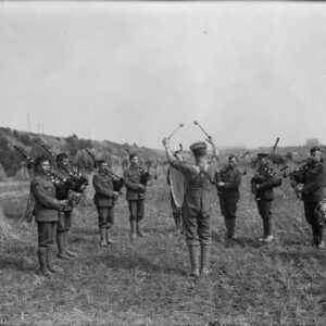 Canadian pipe band practising in a corn field