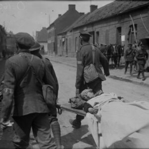 A French woman wounded during a German bombardment behind Cdn lines being taken to dressing station