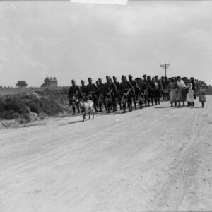 13th Battalion going out to rest after Hill 70, led by pipers and goat