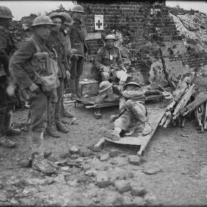 A badly wounded Canadian giving another a light during Hill 70