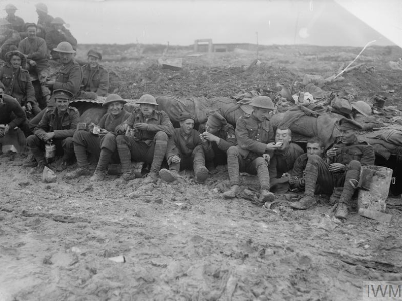 THE BATTLE OF THE SOMME, JULY-NOVEMBER 1916 (Q 1498) Soldiers of the Canadian Expeditionary Force, possibly 25th Battalion (Nova Scotia Rifles) of the 5th Infantry Brigade, 2nd Infantry Division eating rations whilst seated on muddy ground outside a shelter near Pozieres, October 1916, during the final stages of the Battle of the Somme, possibly during the Battle of Le Transloy. Copyright: © IWM. Original Source: http://www.iwm.org.uk/collections/item/object/205072788